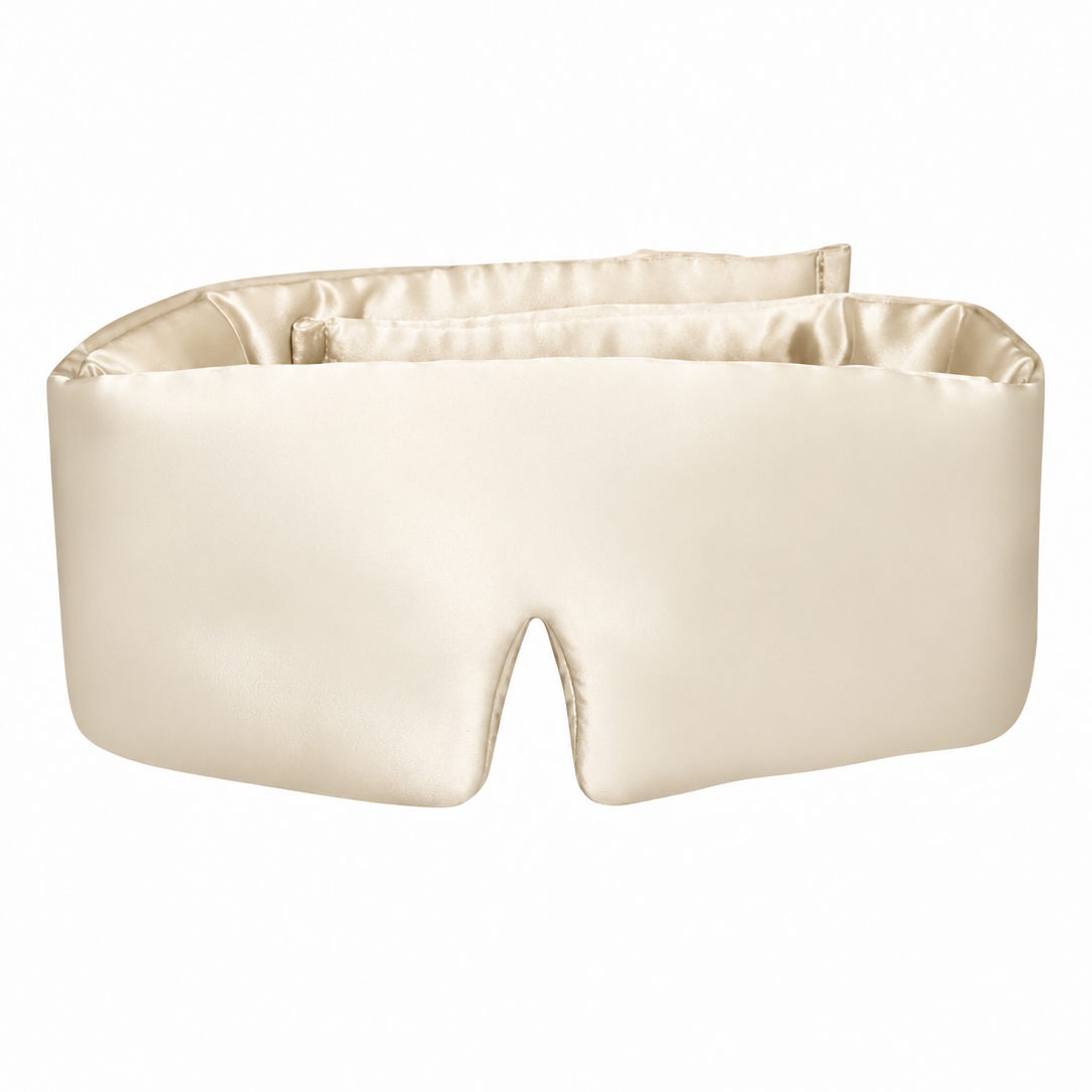 Champagne wraparound silk sleep mask with a padded shape and a contoured nose opening